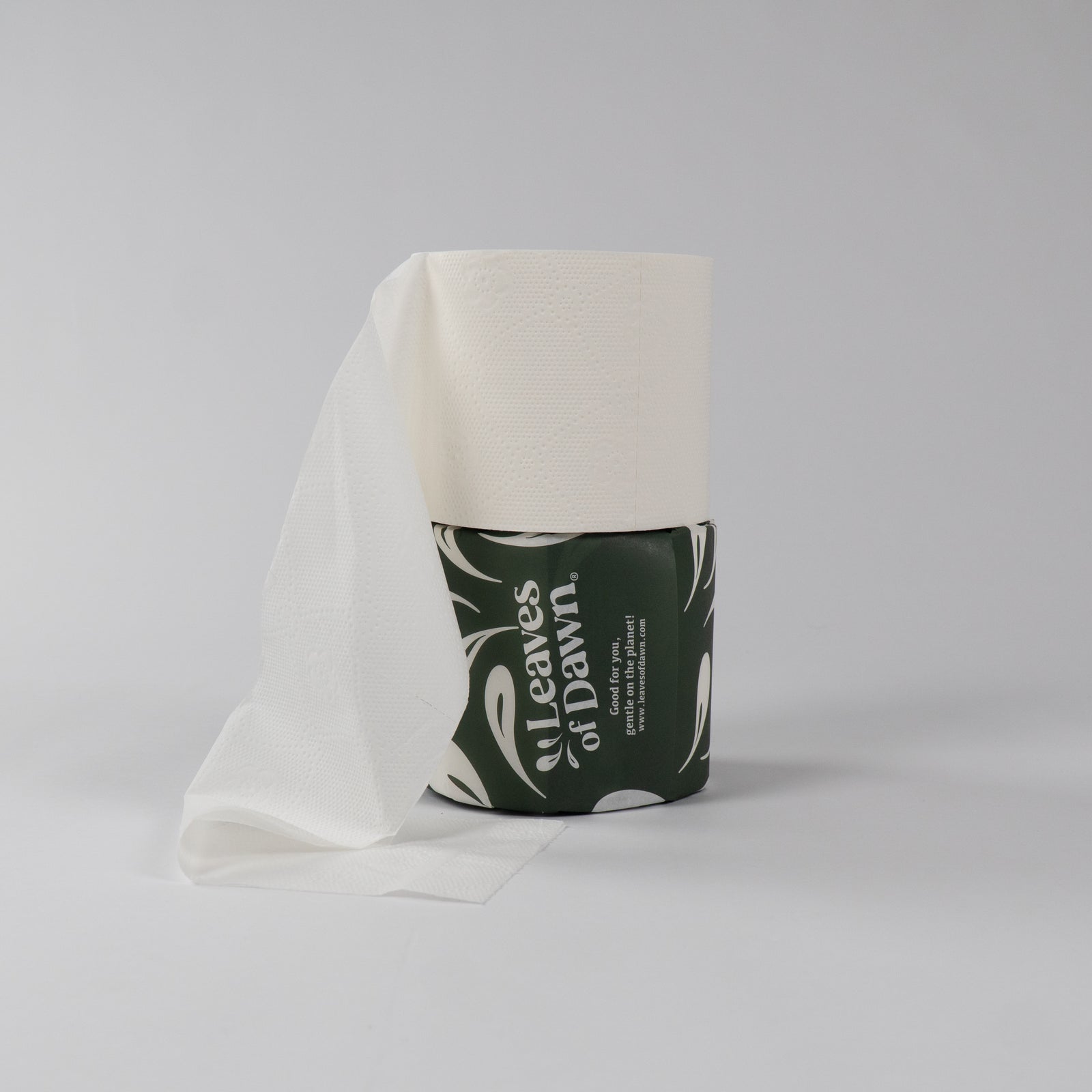 Leaves of Dawn premium 4-ply bamboo toilet paper rolls packshot, showing their softness and texture.